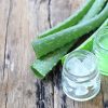 pieces of aloe vera plant sliced up and resting on a table.